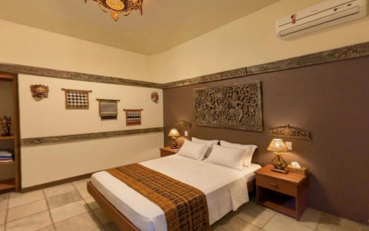 Suíte com cama de casal e ar-condicionado